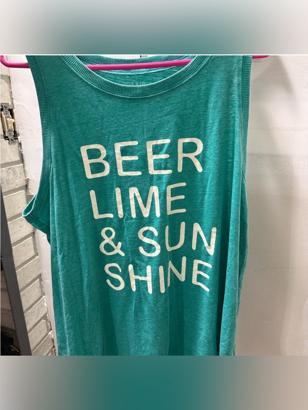 Torrid teal graphic tee with white text